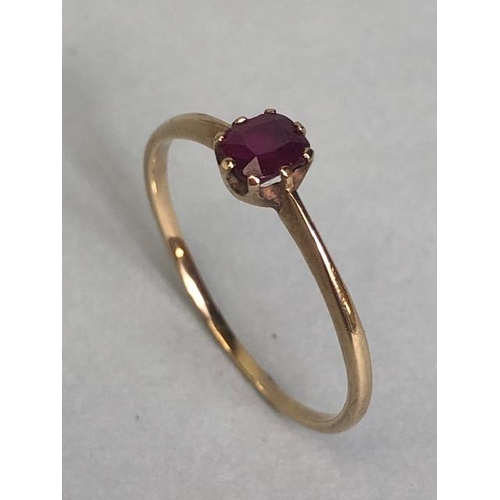 88 - Gold coloured unmarked ring set with faceted pale ruby size approx 'Q'