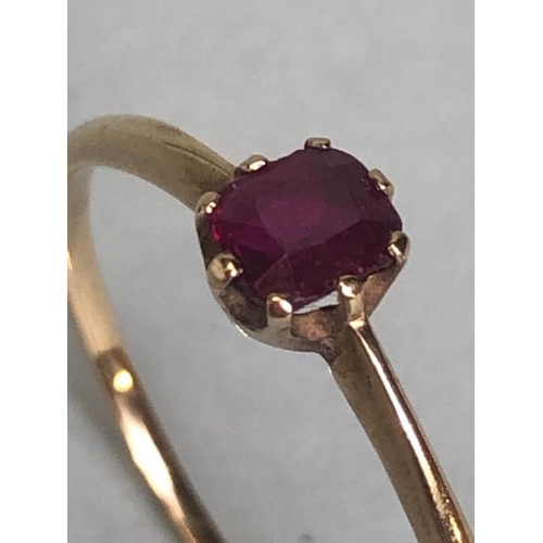 88 - Gold coloured unmarked ring set with faceted pale ruby size approx 'Q'