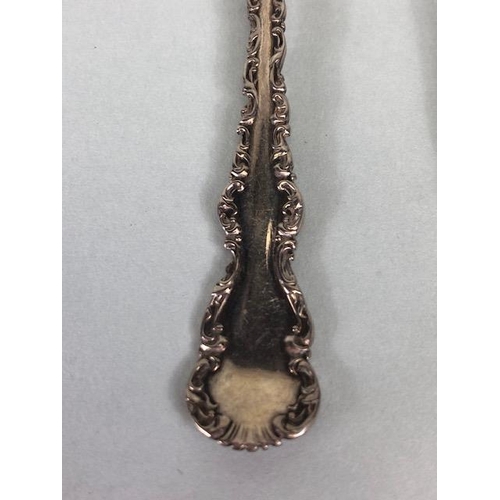 90 - Antique silver collection of items to include tongs, napkin rings, spoons approximately 124.03g