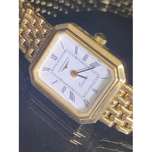 93 - Longines wristwatch with white dial and roman numeral markers on a 9ct Gold strap (quartz) with extr... 