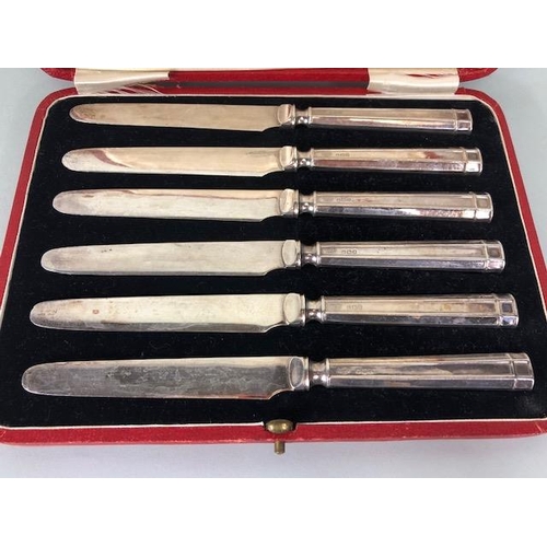 99 - Silver, boxed set of six art deco design cake knives, the silver hallmarked handles of square geomet... 