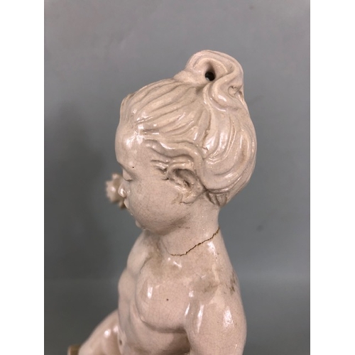 109B - Studio Ceramics, Blanc de Chine,  M Joyce Bidder figure depicting a child riding a fish as a represe... 