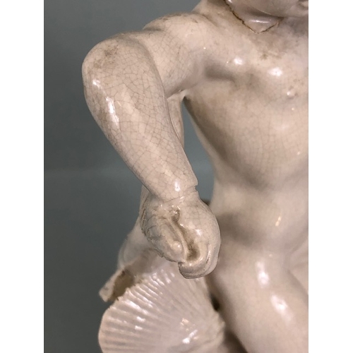 109B - Studio Ceramics, Blanc de Chine,  M Joyce Bidder figure depicting a child riding a fish as a represe... 