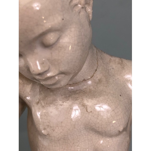 109B - Studio Ceramics, Blanc de Chine,  M Joyce Bidder figure depicting a child riding a fish as a represe... 