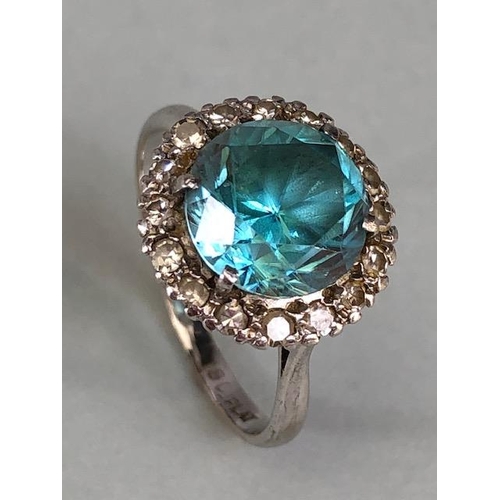 12 - 18ct White Gold and Platinum ring set with an old brilliant cut Aquamarine surrounded by diamonds, a... 