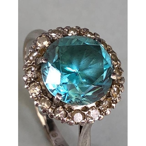 12 - 18ct White Gold and Platinum ring set with an old brilliant cut Aquamarine surrounded by diamonds, a... 