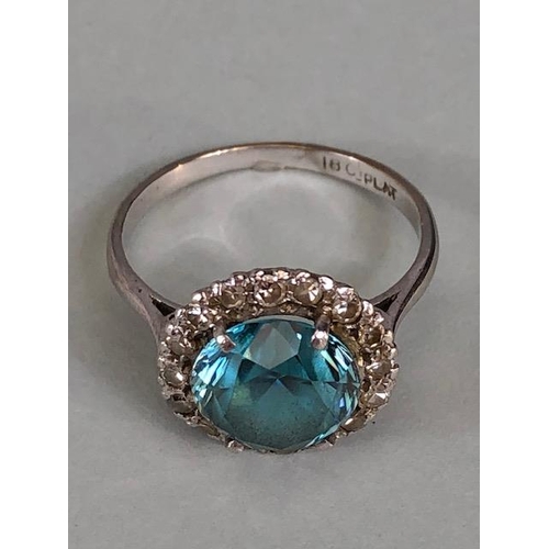 12 - 18ct White Gold and Platinum ring set with an old brilliant cut Aquamarine surrounded by diamonds, a... 