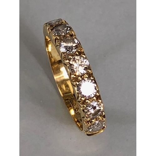 17 - 18ct gold hallmarked half eternity ring set with seven round brilliant cut diamonds, approximately 3... 