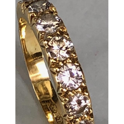 17 - 18ct gold hallmarked half eternity ring set with seven round brilliant cut diamonds, approximately 3... 