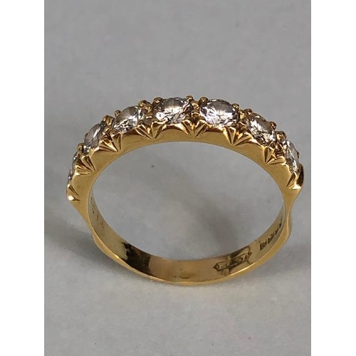 17 - 18ct gold hallmarked half eternity ring set with seven round brilliant cut diamonds, approximately 3... 