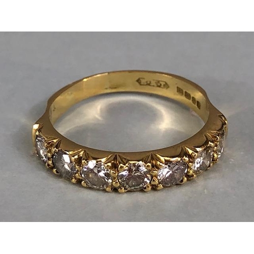 17 - 18ct gold hallmarked half eternity ring set with seven round brilliant cut diamonds, approximately 3... 