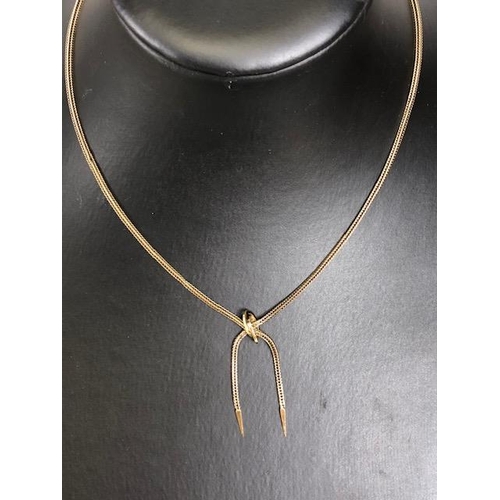 20 - 375 marked gold lariat necklace of square herring bone design, approximately 16 inch and 8.07g