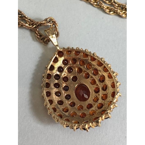 28 - 9ct Gold necklace with a pear shaped 9ct Gold pendant set with Garnet gemstones, necklace approx 60c... 