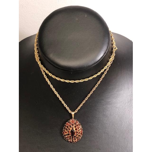 28 - 9ct Gold necklace with a pear shaped 9ct Gold pendant set with Garnet gemstones, necklace approx 60c... 