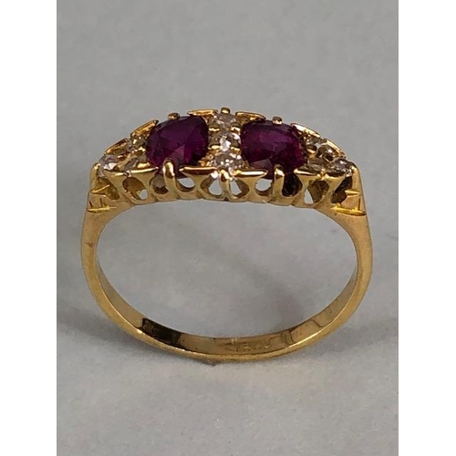 32 - Antique jewellery, 18ct marked ring set with two rubies and nine diamonds, approximately 3.03g, size... 