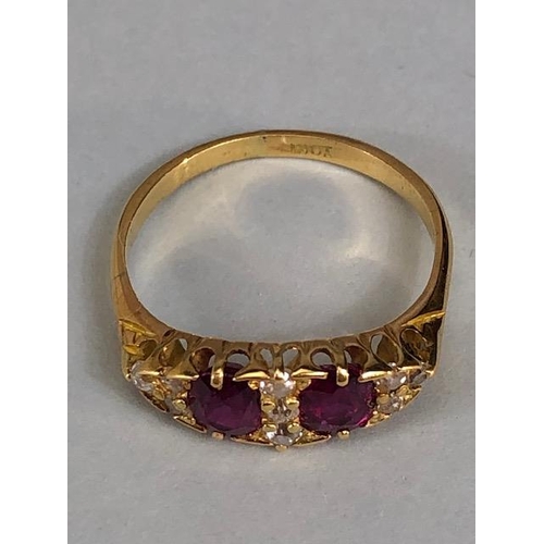 32 - Antique jewellery, 18ct marked ring set with two rubies and nine diamonds, approximately 3.03g, size... 