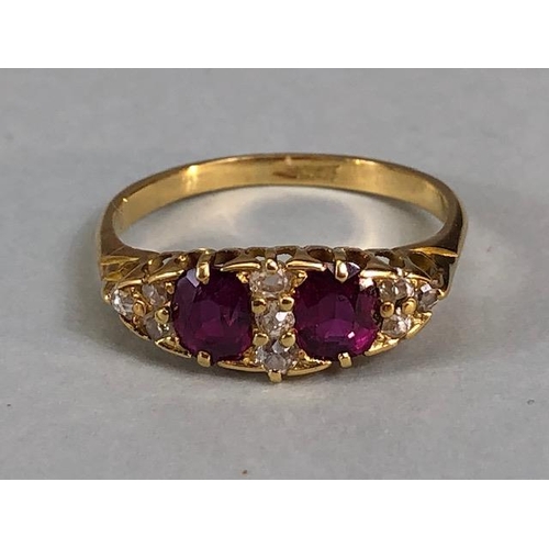 32 - Antique jewellery, 18ct marked ring set with two rubies and nine diamonds, approximately 3.03g, size... 