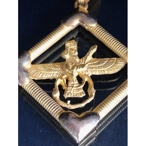 34 - 9ct gold marked cross, approximately 1.2g, and an Egyptian pendant marked Gold 750, approximately 5.... 