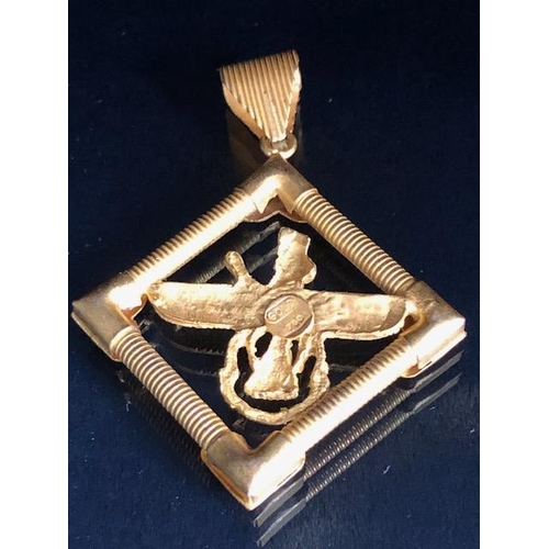 34 - 9ct gold marked cross, approximately 1.2g, and an Egyptian pendant marked Gold 750, approximately 5.... 