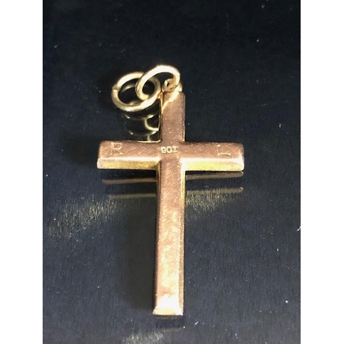 34 - 9ct gold marked cross, approximately 1.2g, and an Egyptian pendant marked Gold 750, approximately 5.... 