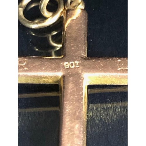 34 - 9ct gold marked cross, approximately 1.2g, and an Egyptian pendant marked Gold 750, approximately 5.... 