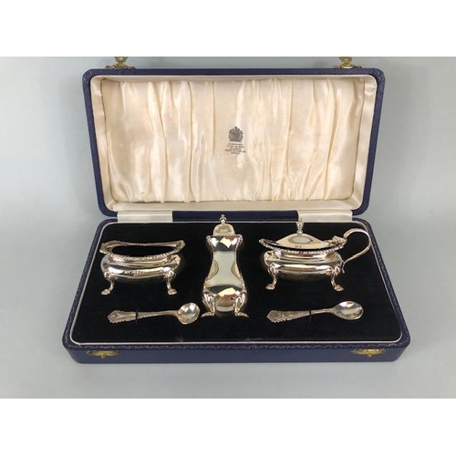 62 - Presentation boxed Silver hallmarked cruet set comprising Salt, Mustard with blue glass liners and P... 