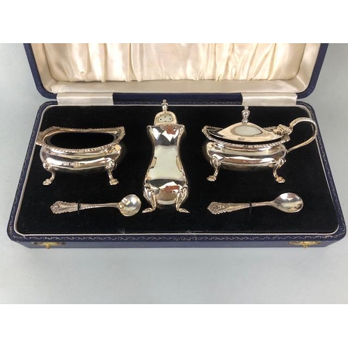 62 - Presentation boxed Silver hallmarked cruet set comprising Salt, Mustard with blue glass liners and P... 