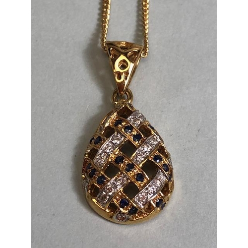 9 - 18ct Gold necklace with an 18ct Gold pear shaped pierced design pendant set with Diamonds and Sapphi... 