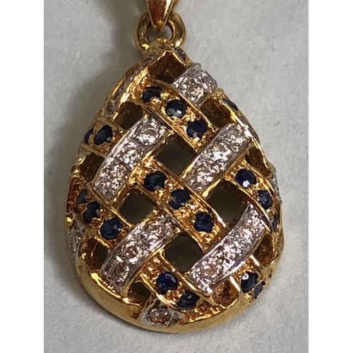 9 - 18ct Gold necklace with an 18ct Gold pear shaped pierced design pendant set with Diamonds and Sapphi... 