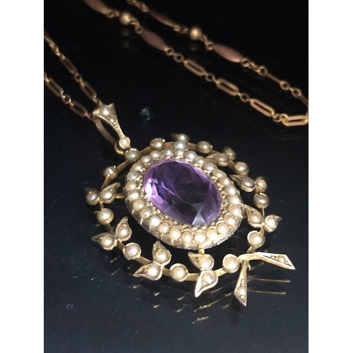 12 - Antique Jewellery, 19th century 9ct gold pendant of a central oval Amethyst surrounded by seed pearl... 