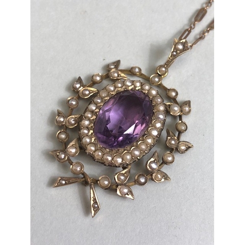 12 - Antique Jewellery, 19th century 9ct gold pendant of a central oval Amethyst surrounded by seed pearl... 