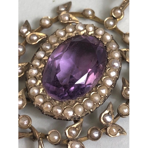 12 - Antique Jewellery, 19th century 9ct gold pendant of a central oval Amethyst surrounded by seed pearl... 