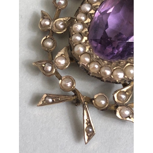 12 - Antique Jewellery, 19th century 9ct gold pendant of a central oval Amethyst surrounded by seed pearl... 