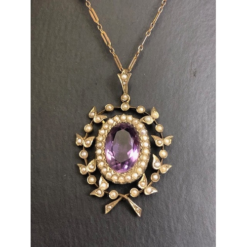 12 - Antique Jewellery, 19th century 9ct gold pendant of a central oval Amethyst surrounded by seed pearl... 