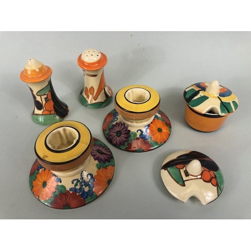 121 - Clarice Cliff, Art Deco interest, group of ceramics to include a pair of GAYDAY squat candle holders... 