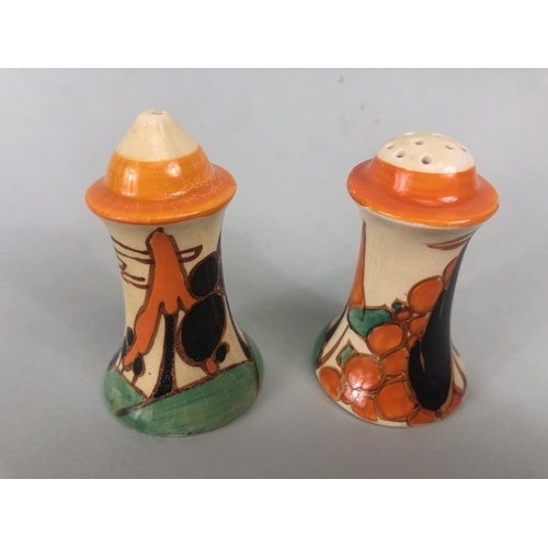 121 - Clarice Cliff, Art Deco interest, group of ceramics to include a pair of GAYDAY squat candle holders... 