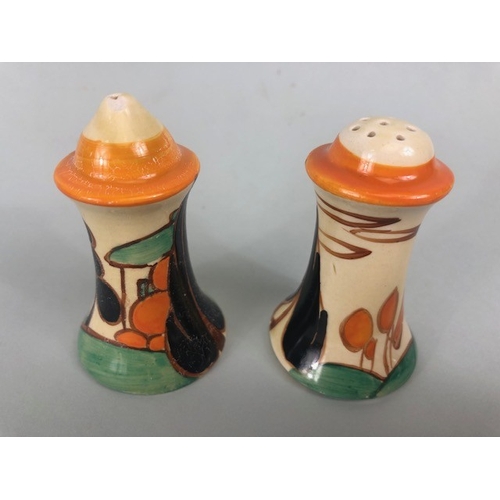 121 - Clarice Cliff, Art Deco interest, group of ceramics to include a pair of GAYDAY squat candle holders... 