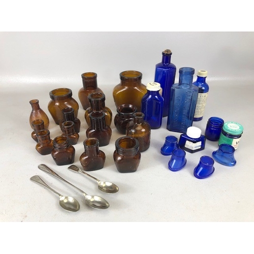 136 - Antique and vintage Advertising  bottles in blue and brown glass OXO, Poison, medical OXO spoons, an... 