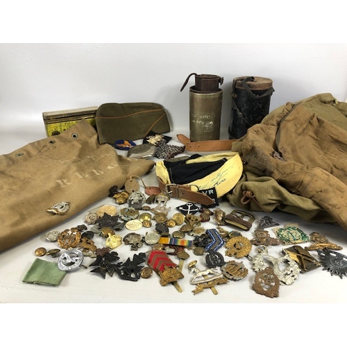 145 - Military interest collection of WW1 and WW2 items to include British and commonwealth cap badges col... 