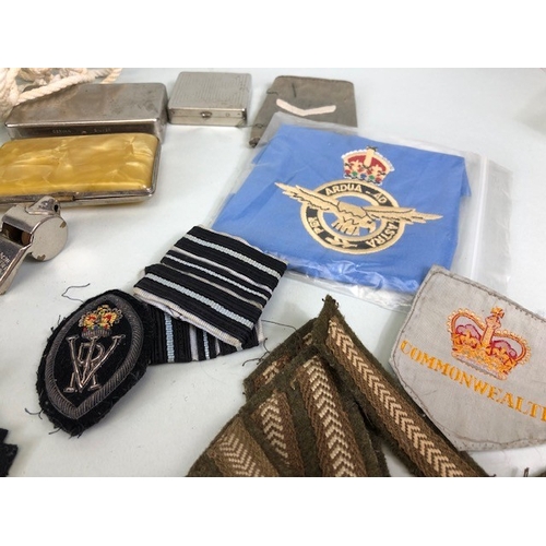 145 - Military interest collection of WW1 and WW2 items to include British and commonwealth cap badges col... 