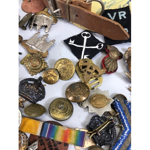 145 - Military interest collection of WW1 and WW2 items to include British and commonwealth cap badges col... 