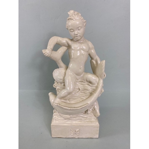 169 - Studio Ceramics, Blanc de Chine,  M Joyce Bidder figure depicting a child riding a fish as a represe... 