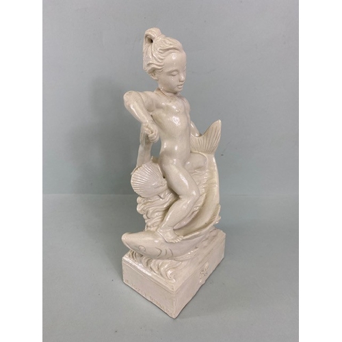 169 - Studio Ceramics, Blanc de Chine,  M Joyce Bidder figure depicting a child riding a fish as a represe... 