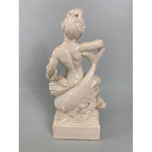 169 - Studio Ceramics, Blanc de Chine,  M Joyce Bidder figure depicting a child riding a fish as a represe... 