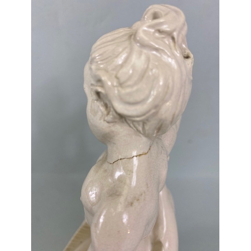 169 - Studio Ceramics, Blanc de Chine,  M Joyce Bidder figure depicting a child riding a fish as a represe... 