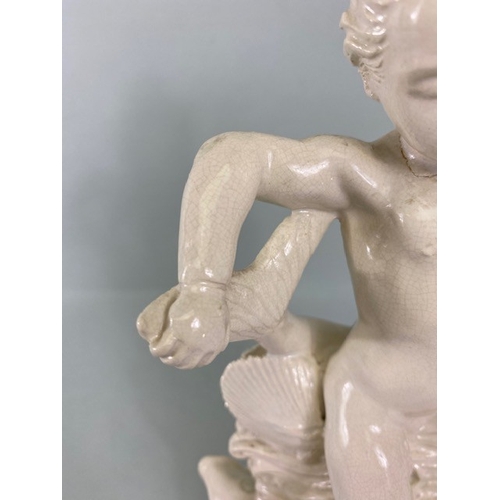 169 - Studio Ceramics, Blanc de Chine,  M Joyce Bidder figure depicting a child riding a fish as a represe... 