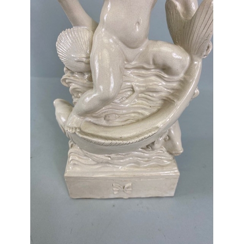 169 - Studio Ceramics, Blanc de Chine,  M Joyce Bidder figure depicting a child riding a fish as a represe... 