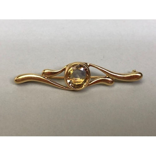 16A - 18ct Gold Brooch set with a faceted Pale yellow Topaz approx 5cm in length and total weight approx 6... 