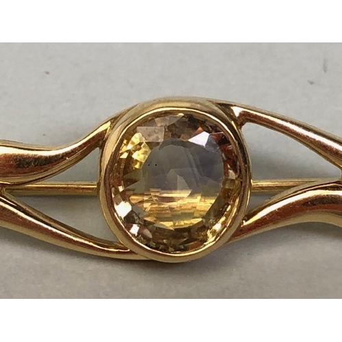 16A - 18ct Gold Brooch set with a faceted Pale yellow Topaz approx 5cm in length and total weight approx 6... 