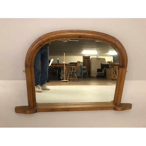 173 - Modern pine framed half moon overmantel mirror approximately 74 x 110cm